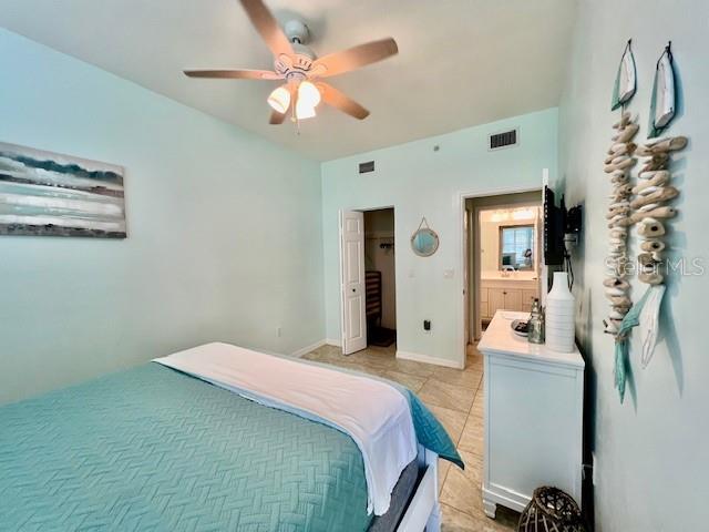 2060 Matecumbe Key Road, Unit 2102 Punta Gorda, FL 33955 - Photo 31 of 51 a bedroom with a bed and a chandelier