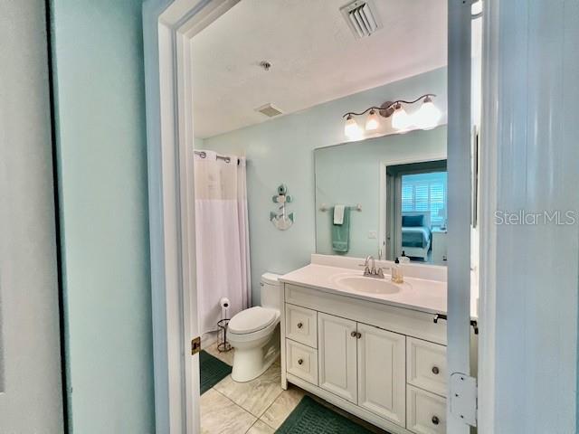 2060 Matecumbe Key Road, Unit 2102 Punta Gorda, FL 33955 - Photo 33 of 51 a bathroom with a double vanity sink toilet mirror and bathtub