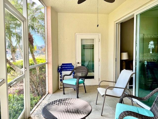 2060 Matecumbe Key Road, Unit 2102 Punta Gorda, FL 33955 - Photo 7 of 51 a living room with furniture and a floor to ceiling window