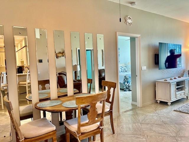 2060 Matecumbe Key Road, Unit 2102 Punta Gorda, FL 33955 - Photo 10 of 51 a view of a dining room with furniture and wooden floor