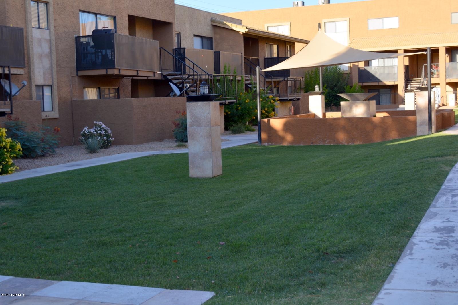 5401 East Thomas Road, Unit 1032 Phoenix, AZ 85018 - Photo 33 of 34 a view of a house with backyard and sitting area