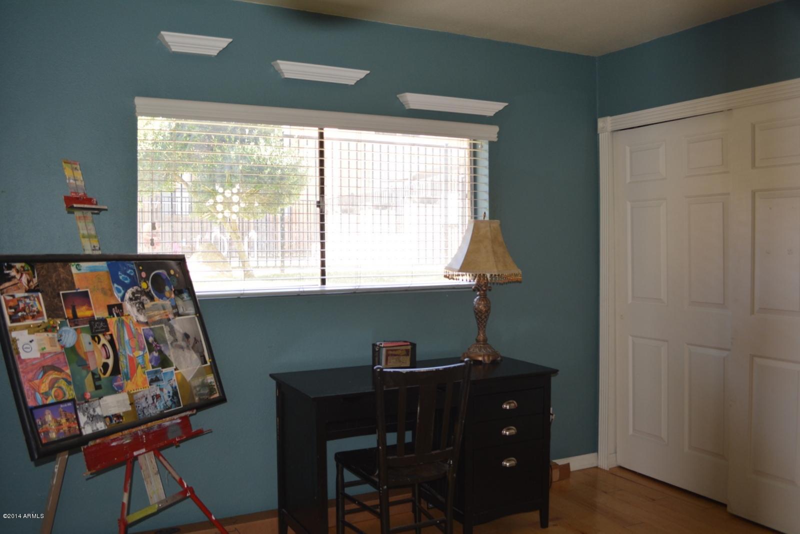 5401 East Thomas Road, Unit 1032 Phoenix, AZ 85018 - Photo 7 of 34 a room with furniture and a window