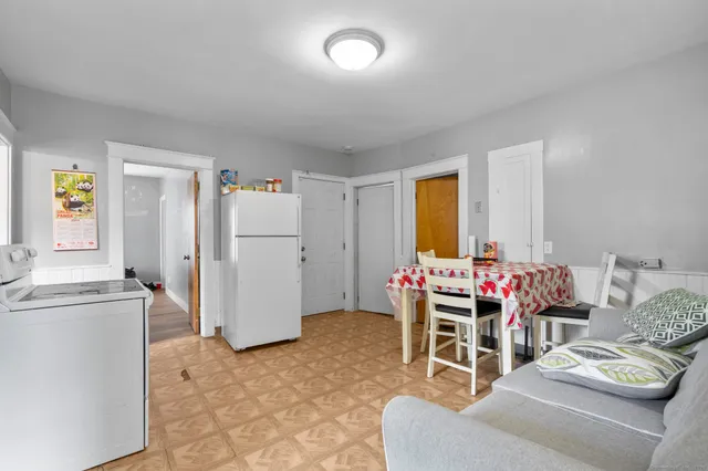 a bedroom with furniture and a fireplace