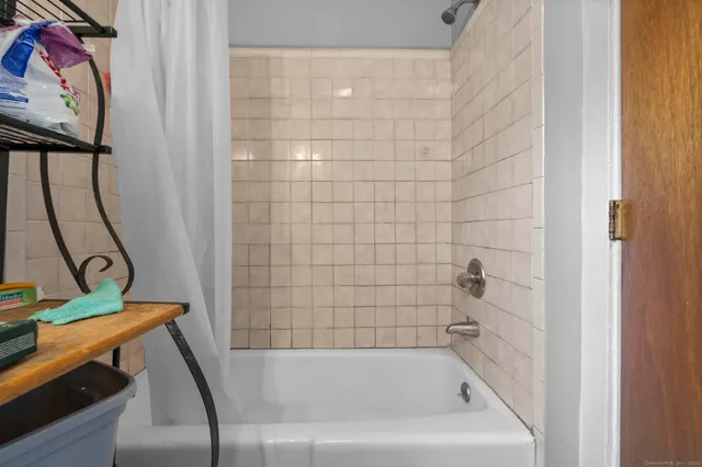 a bathroom with a toilet a sink and a window