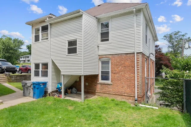 a view of backyard with a garden and deck