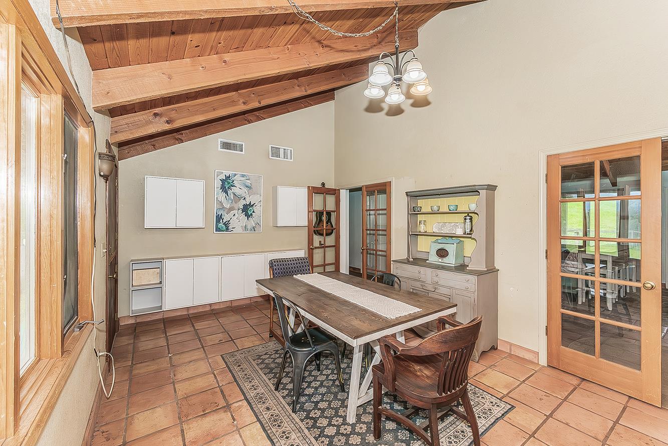 30240 Watts Valley Road Tollhouse, CA 93667 - Photo 11 of 65 a view of a dining room with furniture and chandelier