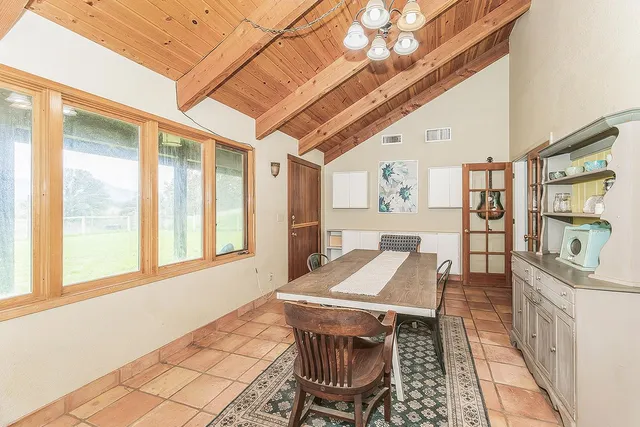 a kitchen with a sink refrigerator and window