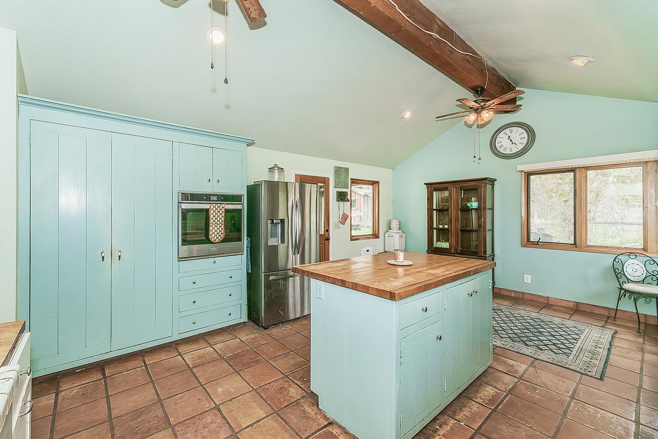 30240 Watts Valley Road Tollhouse, CA 93667 - Photo 15 of 65 a kitchen with a sink refrigerator and window