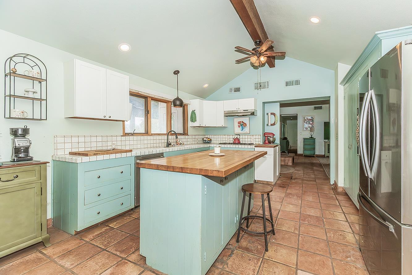 30240 Watts Valley Road Tollhouse, CA 93667 - Photo 17 of 65 a kitchen with a sink a counter top space stainless steel appliances and cabinets