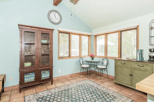 a bedroom with a bed and a ceiling fan