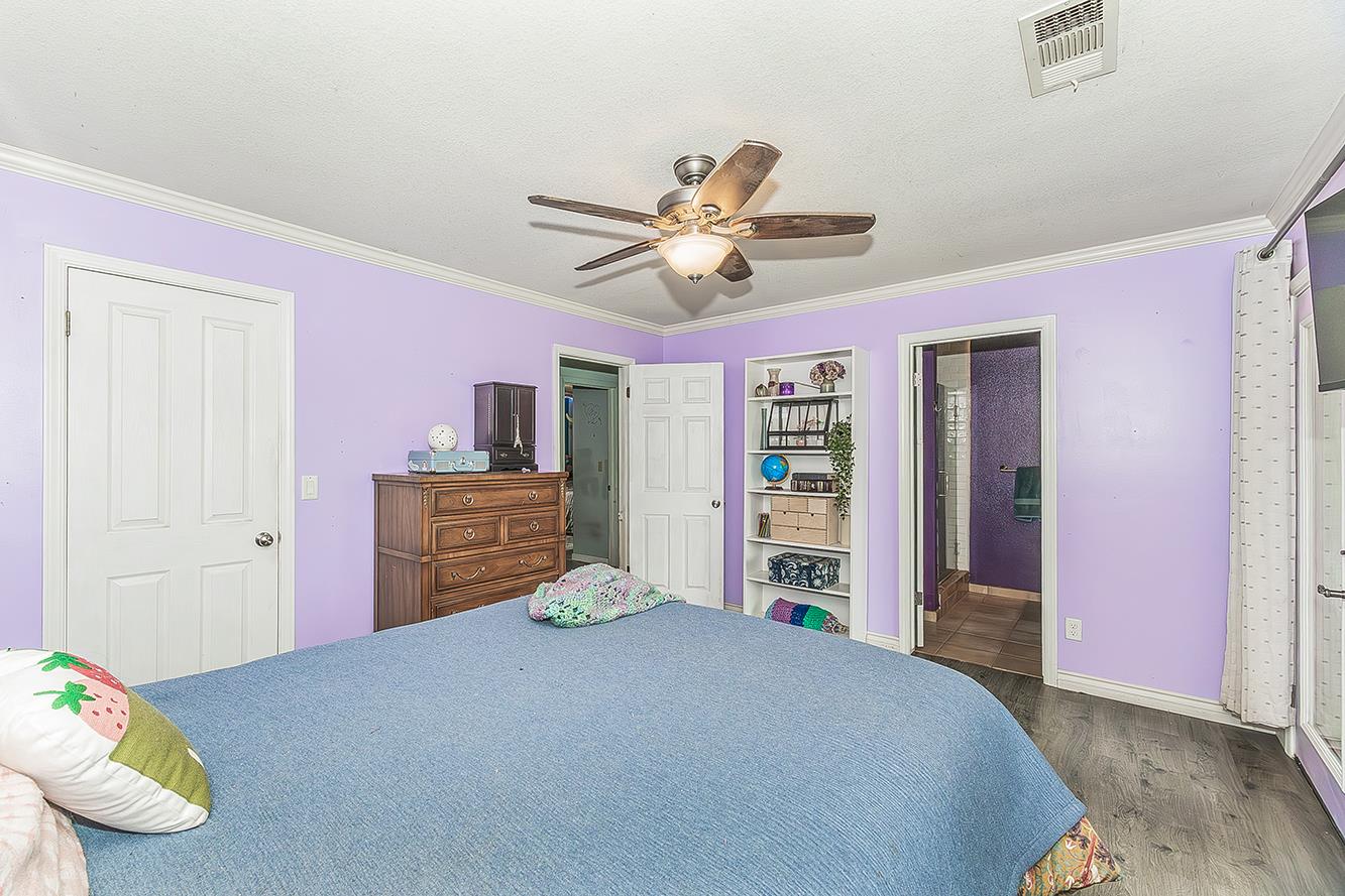 30240 Watts Valley Road Tollhouse, CA 93667 - Photo 22 of 65 a bedroom with a bed and a ceiling fan