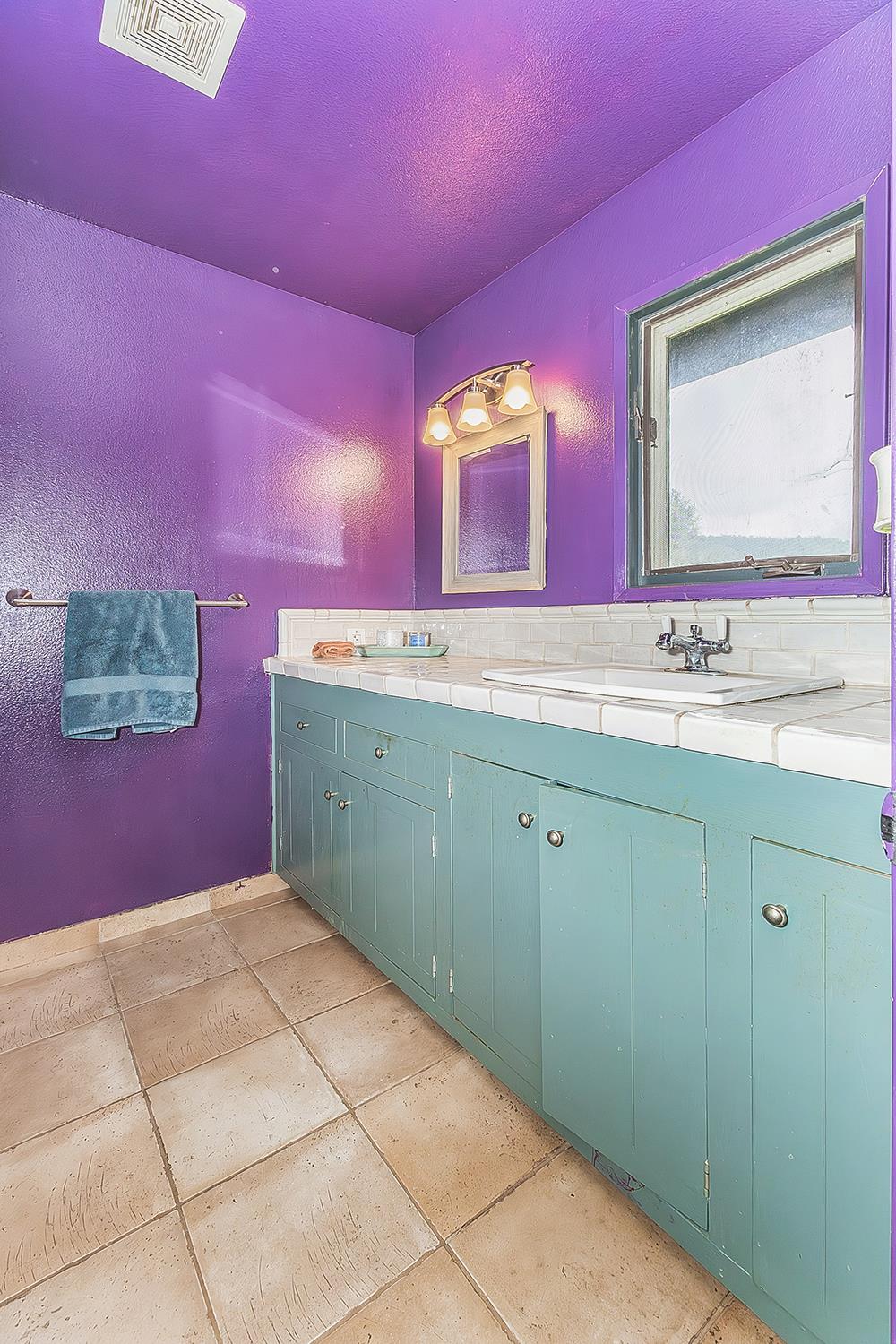 30240 Watts Valley Road Tollhouse, CA 93667 - Photo 23 of 65 a bathroom with a sink mirror and vanity