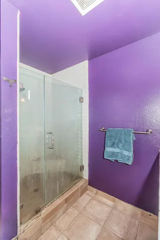 a bedroom with a bed and a table in it