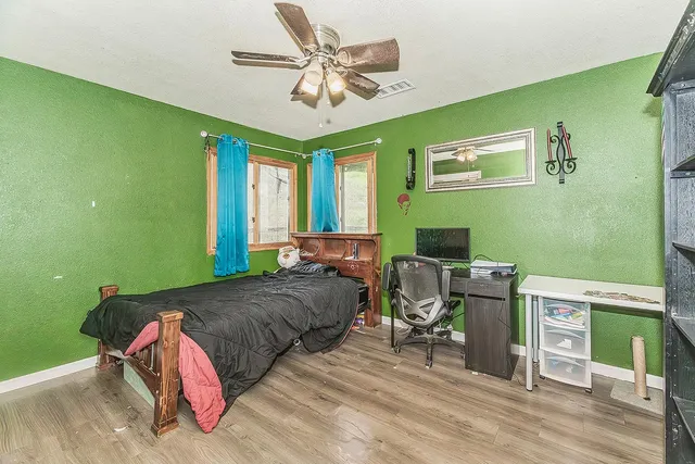 a front view of a house with a yard table and chairs