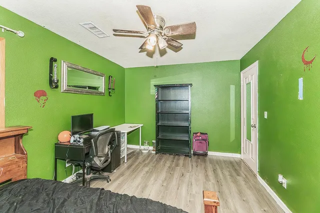 a view of house with backyard