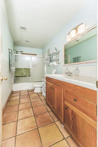 a aerial view of a house with swimming pool and a yard