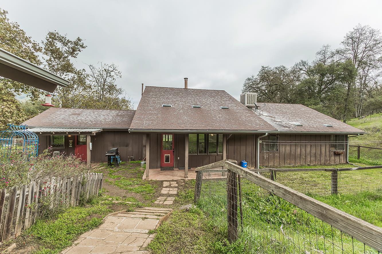 30240 Watts Valley Road Tollhouse, CA 93667 - Photo 32 of 65 a front view of a house with a yard table and chairs