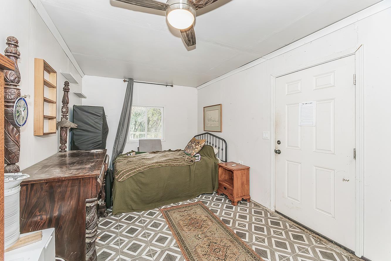 30240 Watts Valley Road Tollhouse, CA 93667 - Photo 38 of 65 a bedroom with a bed and window