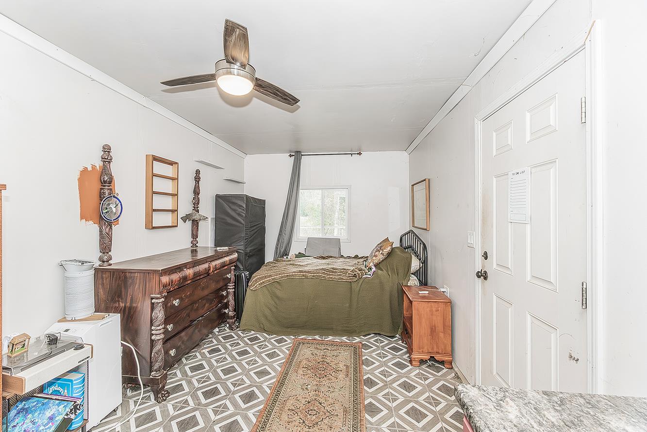 30240 Watts Valley Road Tollhouse, CA 93667 - Photo 39 of 65 a bedroom with furniture and a window