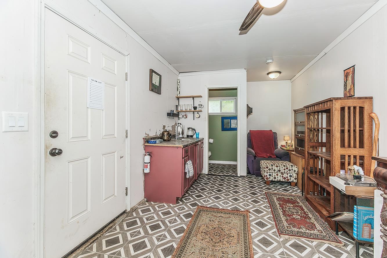 30240 Watts Valley Road Tollhouse, CA 93667 - Photo 40 of 65 a room with furniture a rug and a window