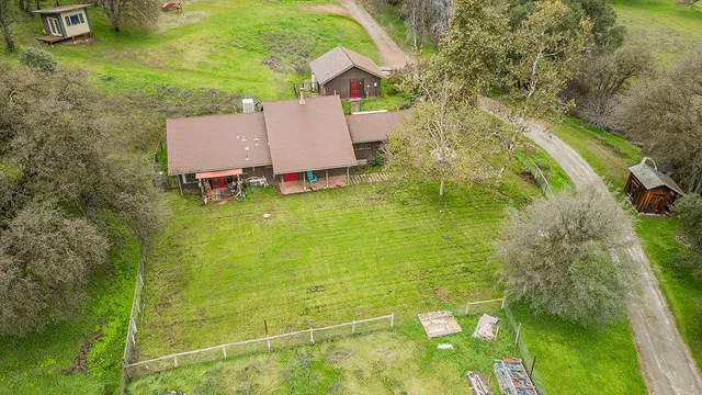 a view of a house with a backyard