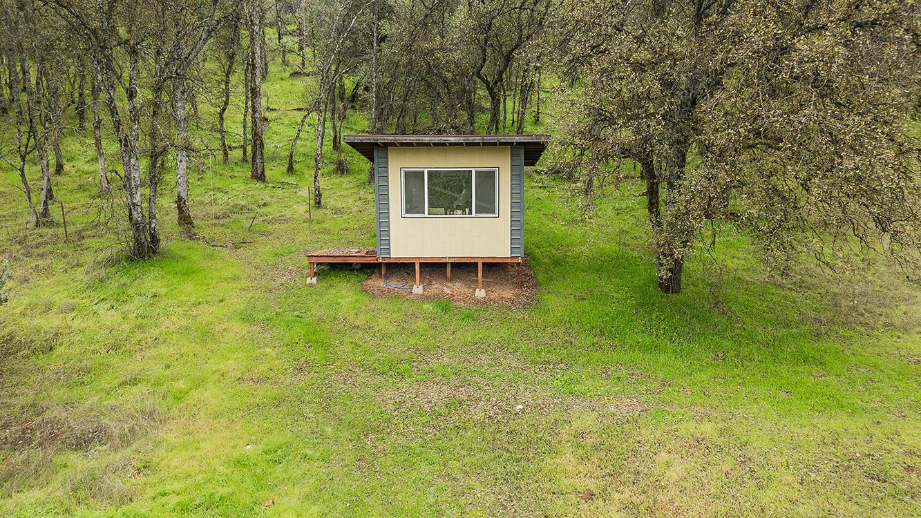 30240 Watts Valley Road Tollhouse, CA 93667 - Photo 55 of 65 a view of a house with a backyard