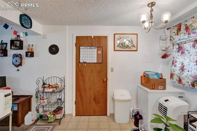 a bathroom with a toilet a sink and a shower curtain