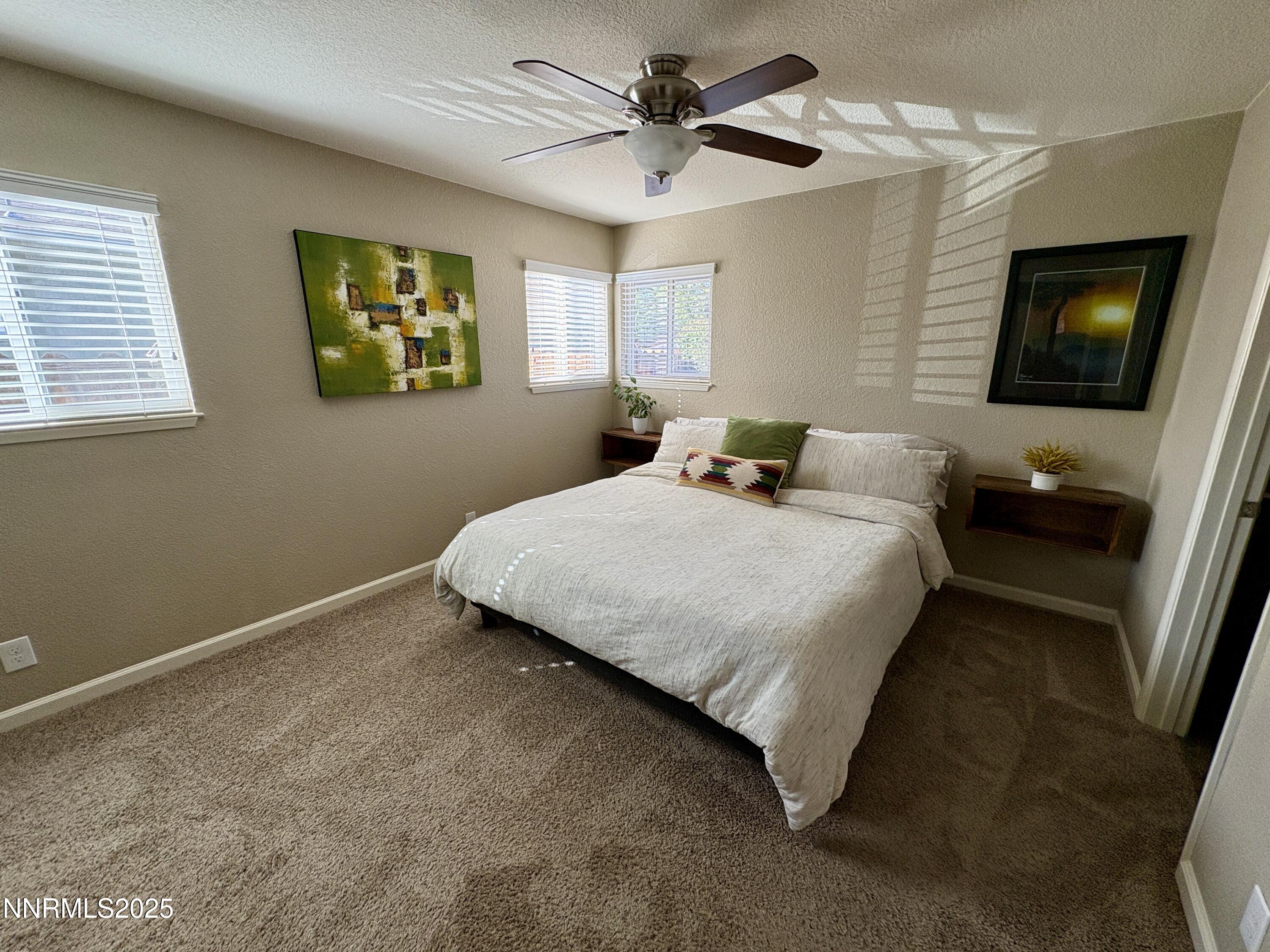 2000 Royal Drive Reno, NV 89503 - Photo 11 of 33 a bedroom with a bed and a flat screen tv