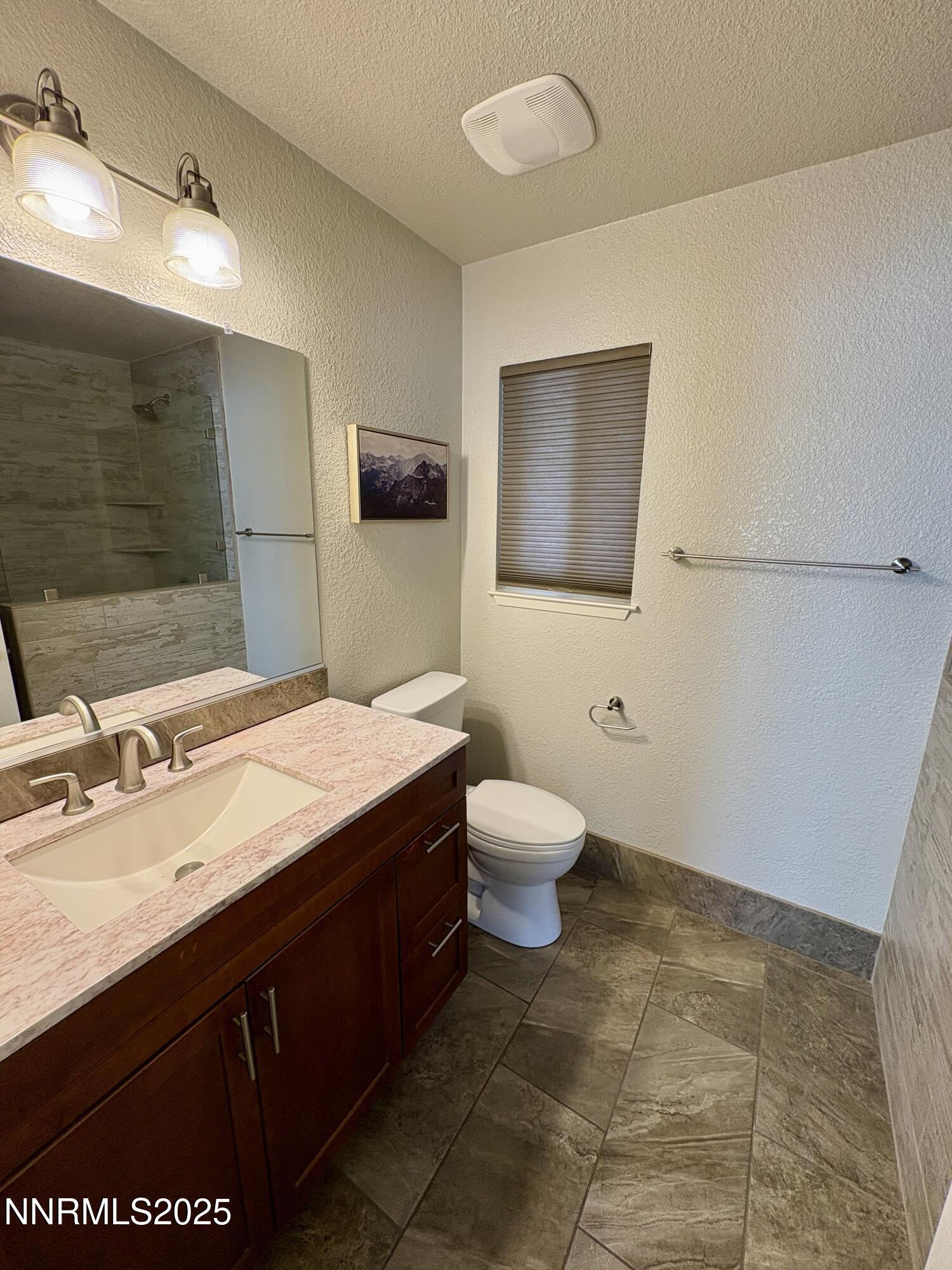 2000 Royal Drive Reno, NV 89503 - Photo 13 of 33 a bathroom with a sink a toilet and mirror
