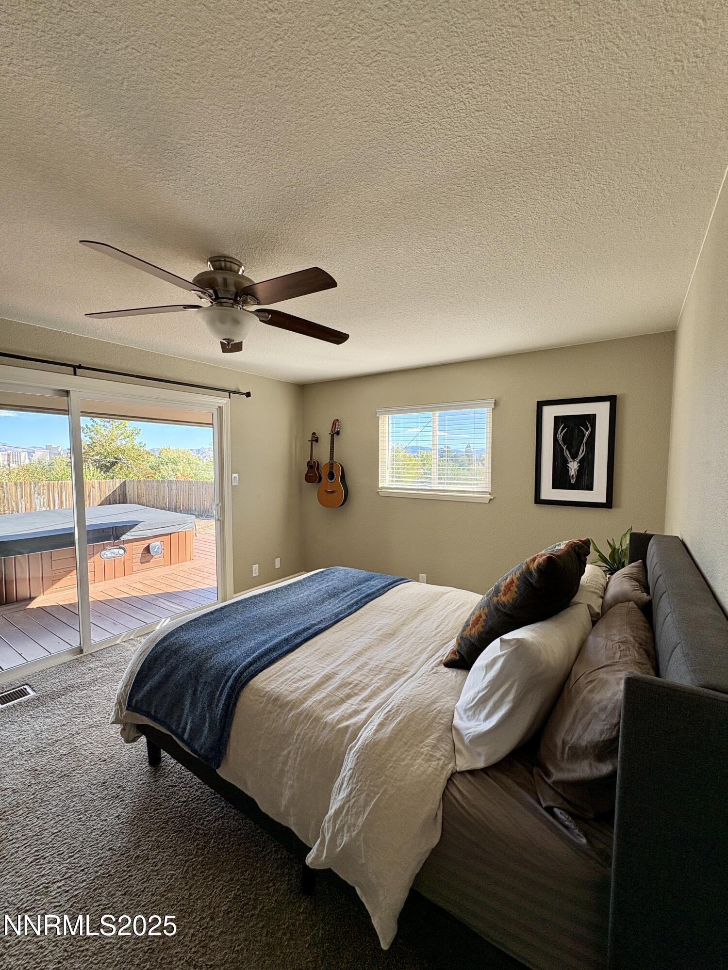 2000 Royal Drive Reno, NV 89503 - Photo 16 of 33 a bedroom with a bed and wooden floor