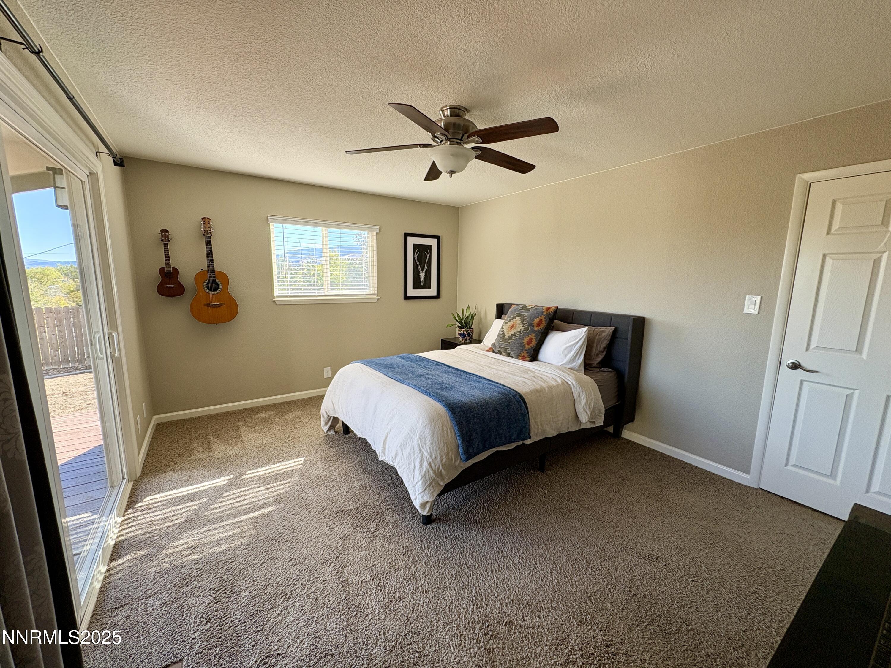 2000 Royal Drive Reno, NV 89503 - Photo 17 of 33 a bedroom with a bed and a mirror