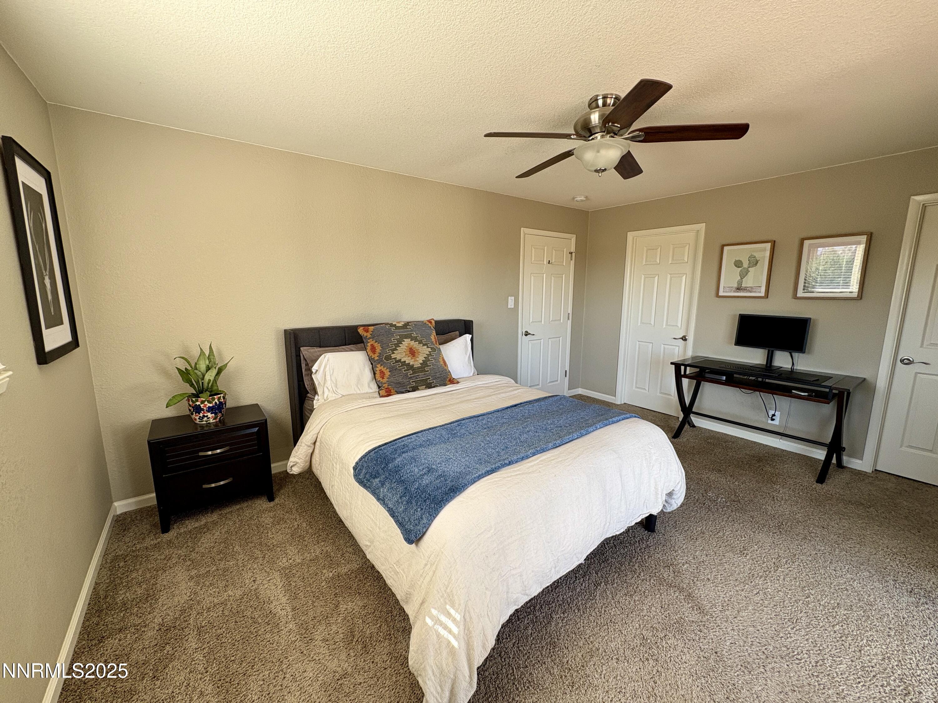 2000 Royal Drive Reno, NV 89503 - Photo 18 of 33 a bedroom with a bed and a chandelier