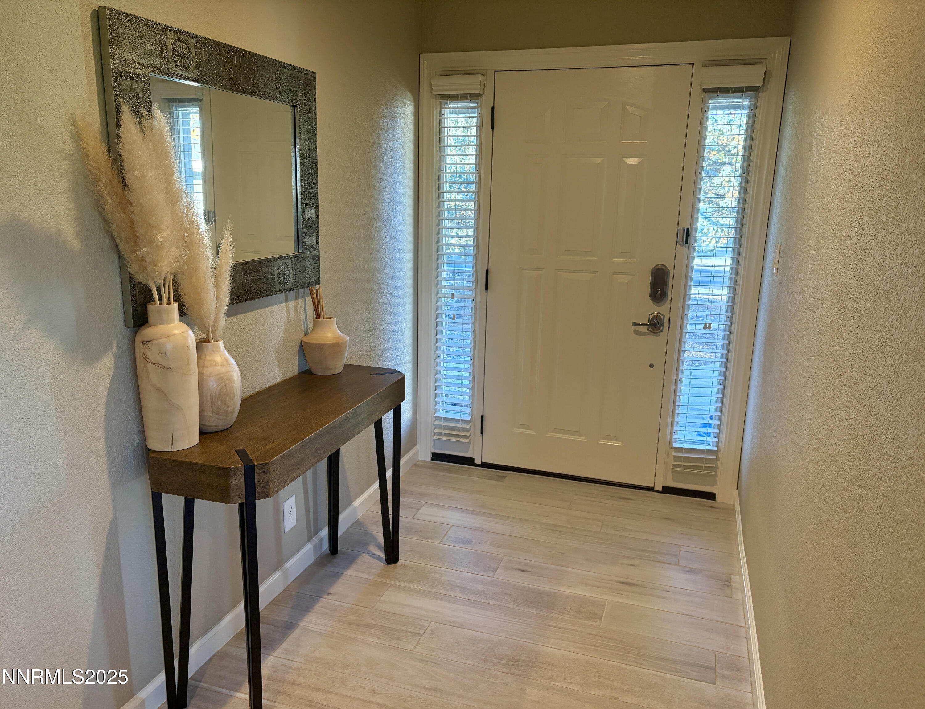 2000 Royal Drive Reno, NV 89503 - Photo 3 of 33 a view of an empty room with wooden floor and a bathroom