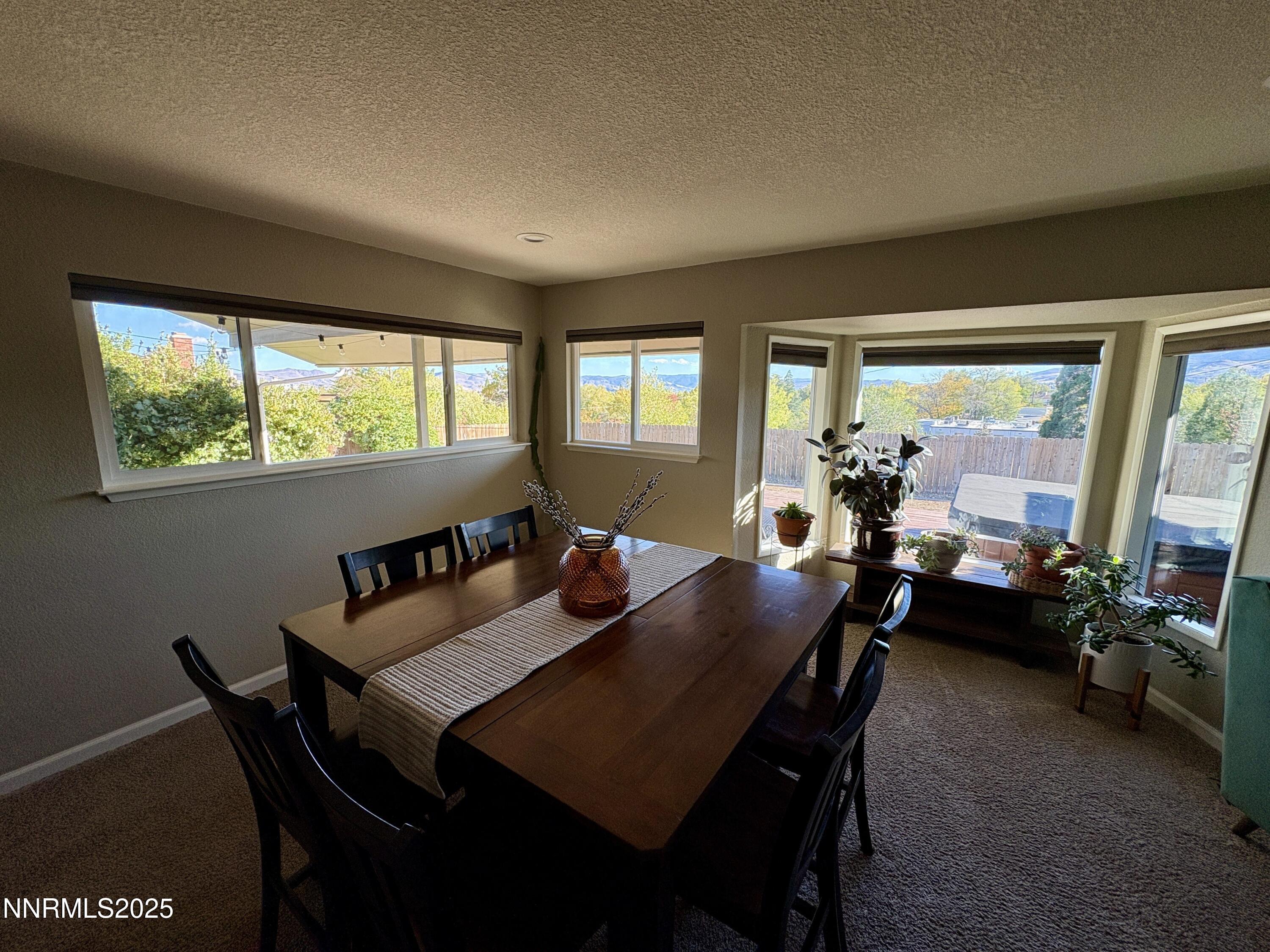2000 Royal Drive Reno, NV 89503 - Photo 6 of 33 a view of a dining room with furniture and a large window