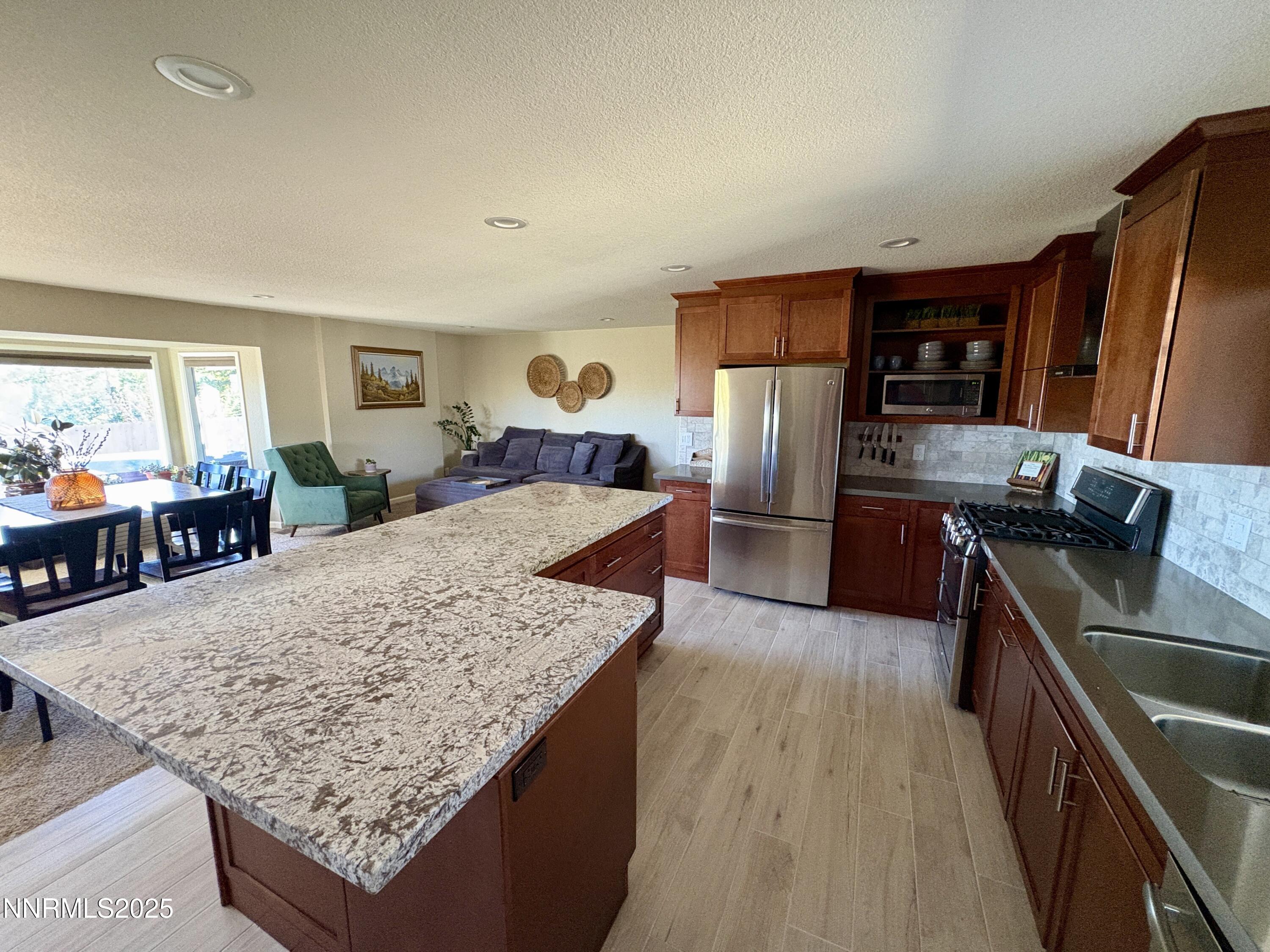 2000 Royal Drive Reno, NV 89503 - Photo 8 of 33 a large kitchen with granite countertop a large counter top appliances and cabinets