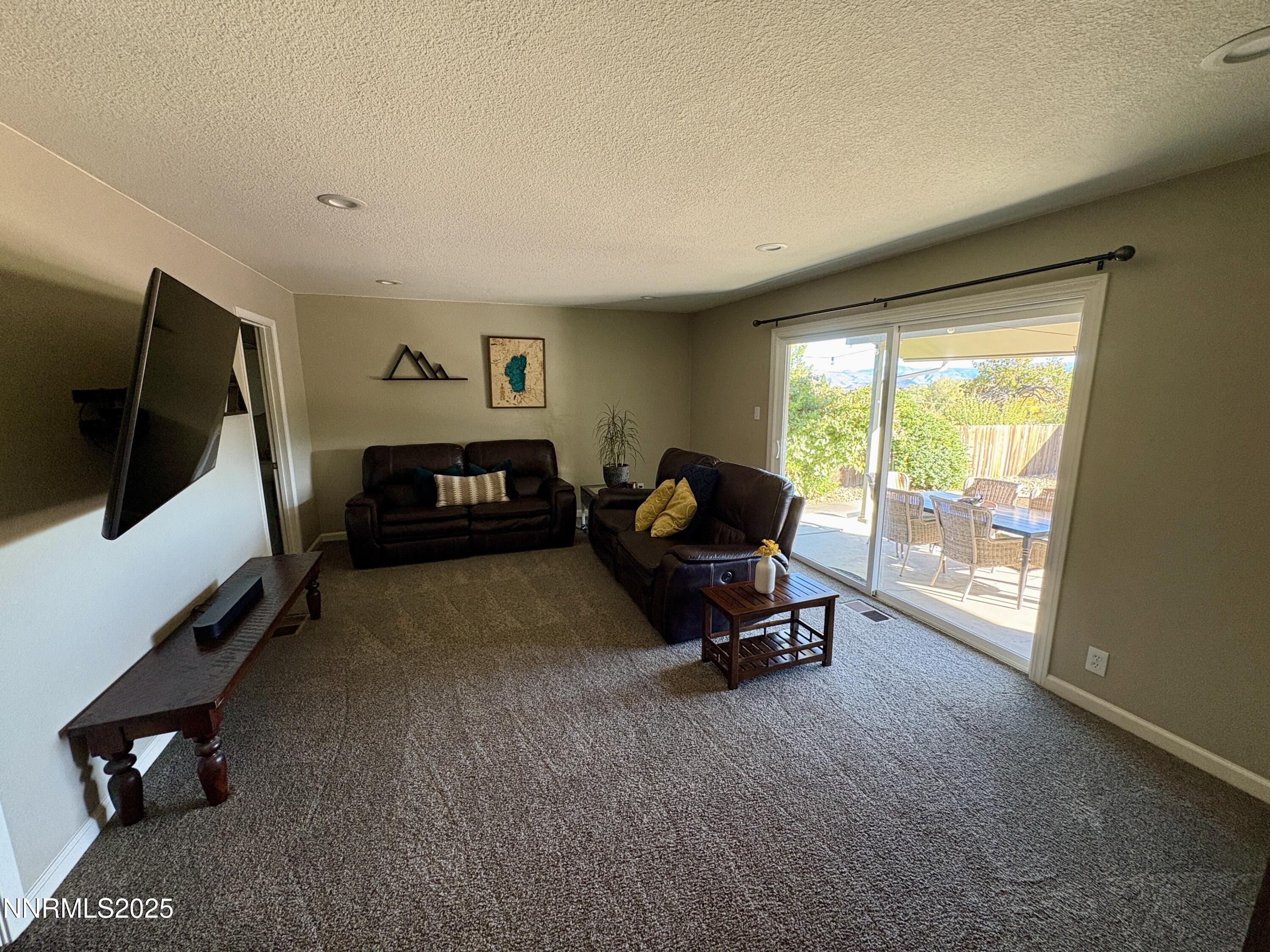 2000 Royal Drive Reno, NV 89503 - Photo 9 of 33 a living room with furniture and a flat screen tv
