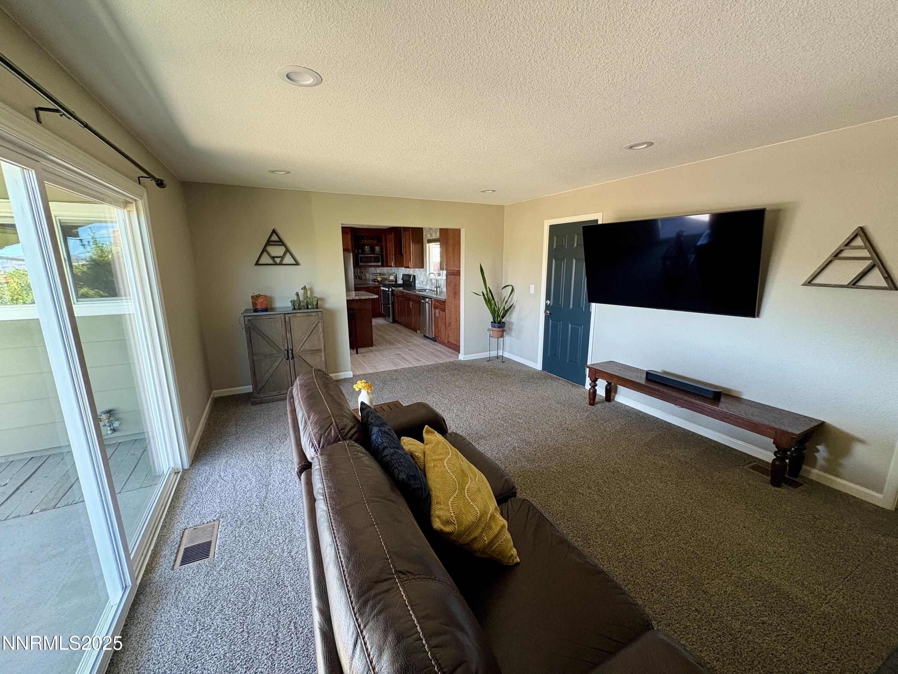 2000 Royal Drive Reno, NV 89503 - Photo 10 of 33 a living room with furniture and a flat screen tv