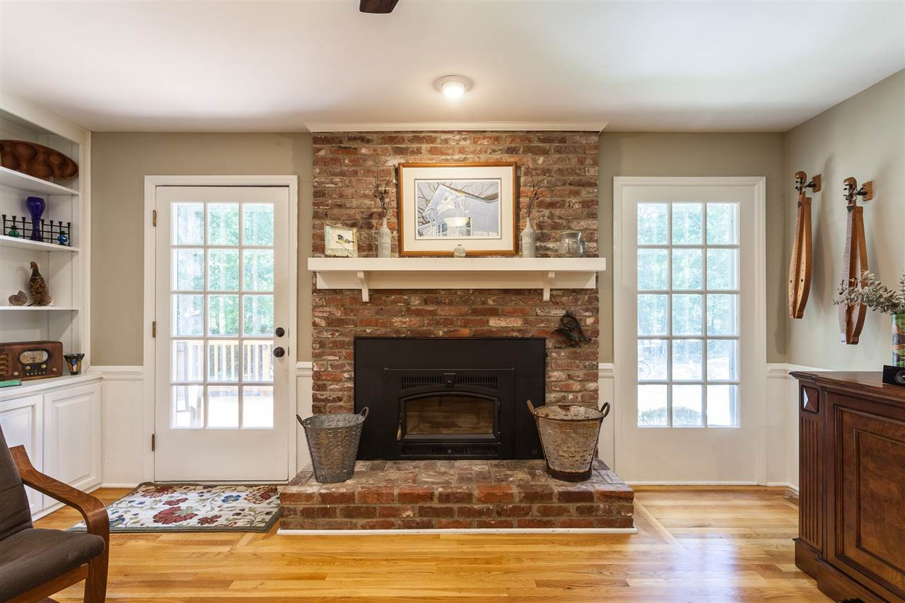 8709 Kenilworth Drive Raleigh, NC 27613 - Photo 9 of 30 With reclaimed bricks and a wood burning insert. This insert considerably reduces the heating costs of this home Fireplace