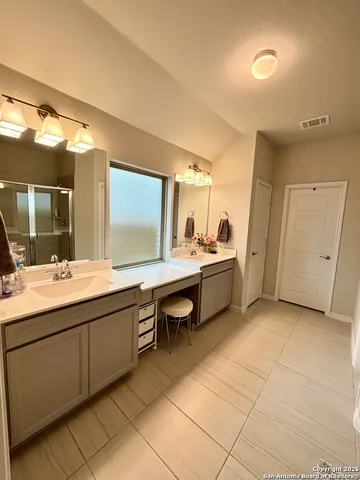 a room with a sink and cabinets