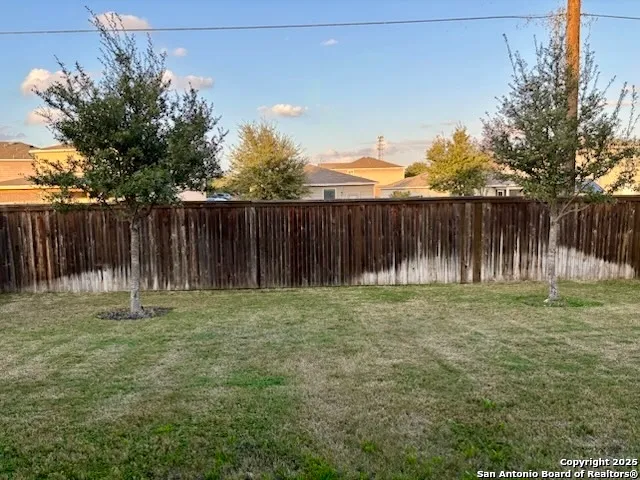 a backyard of a house with lots of green space