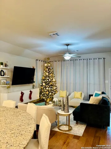 a living room with furniture and a flat screen tv