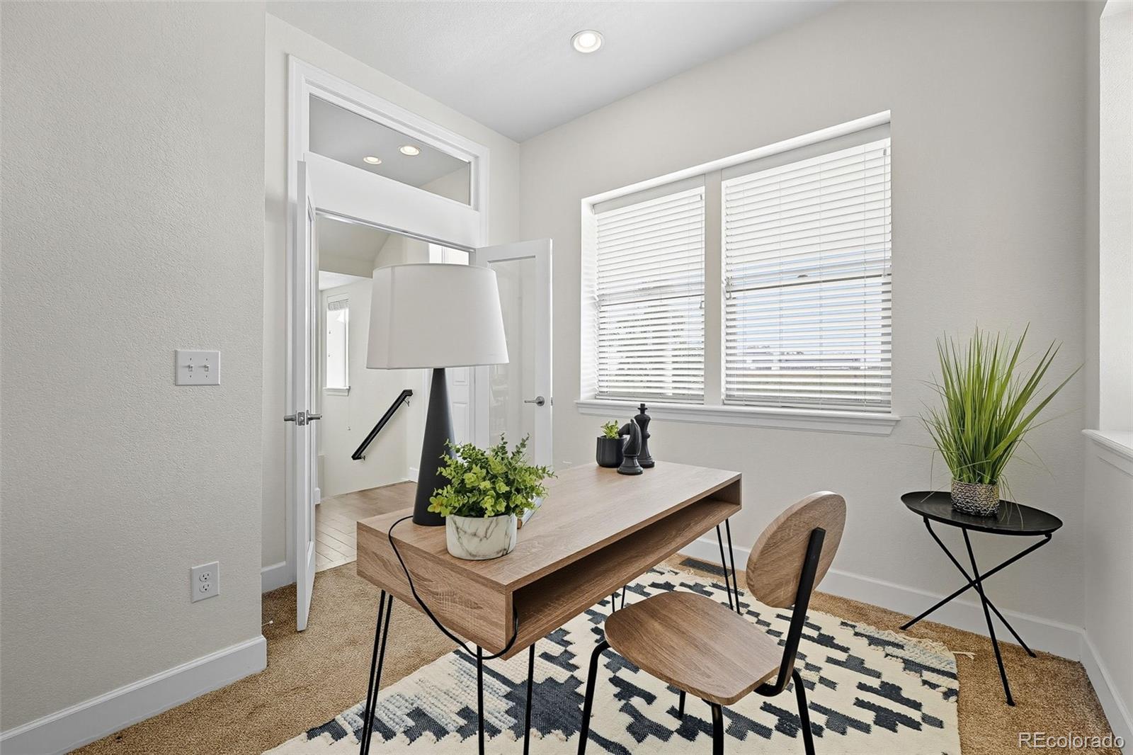 5207 Clinton Street Denver, CO 80238 - Photo 16 of 43 a view of a livingroom and dining room