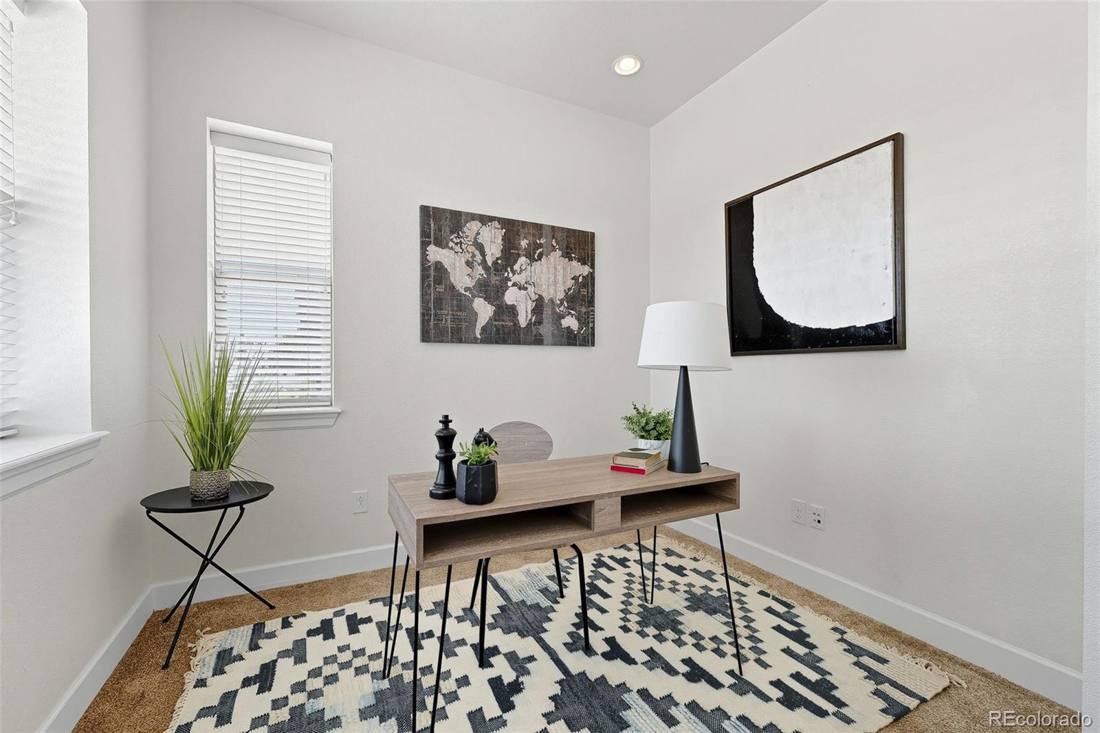 5207 Clinton Street Denver, CO 80238 - Photo 17 of 43 a table room with furniture and window