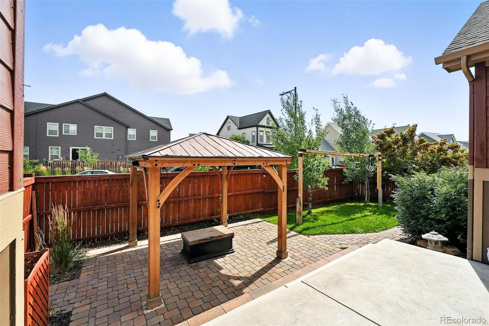 5207 Clinton Street Denver, CO 80238 - Photo 25 of 43 a view of a house with a yard