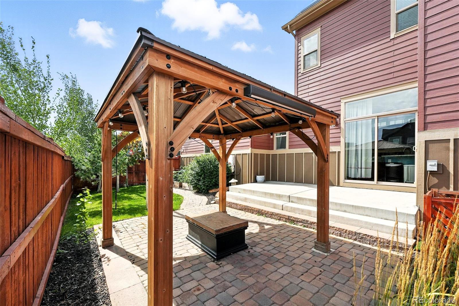 5207 Clinton Street Denver, CO 80238 - Photo 27 of 43 a wooden bench sitting in front of a house