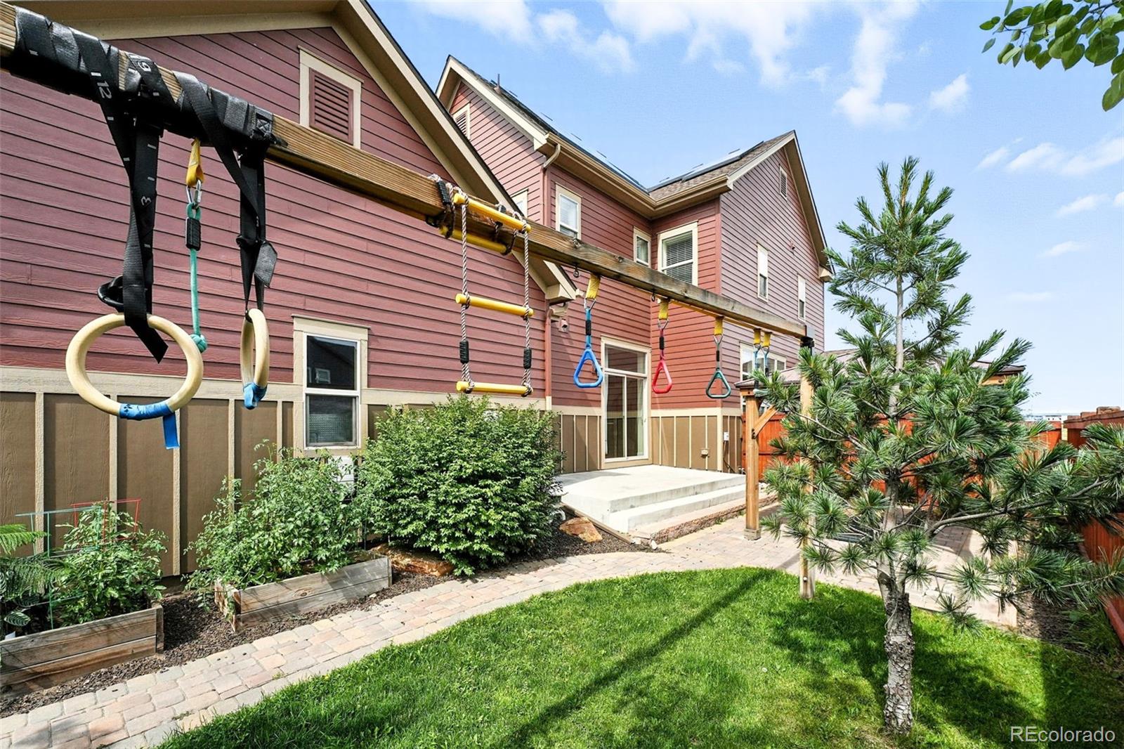5207 Clinton Street Denver, CO 80238 - Photo 31 of 43 a view of a patio with table and chairs and potted plants