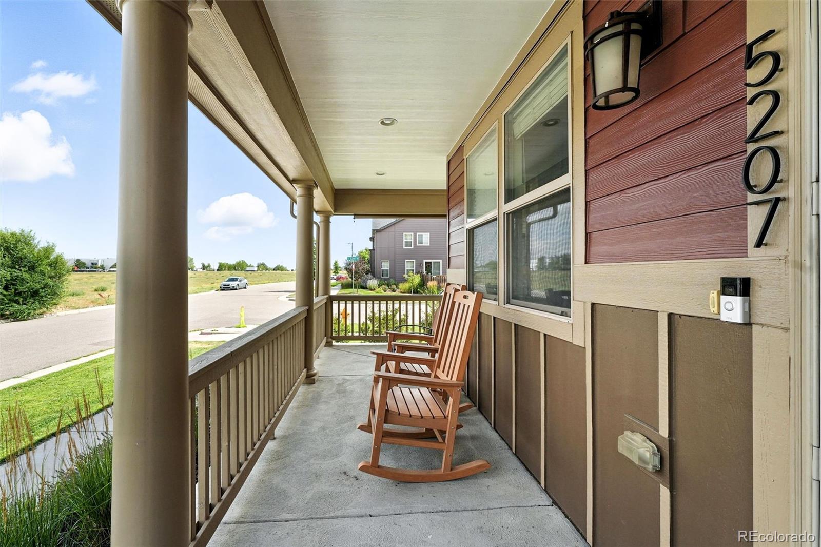 5207 Clinton Street Denver, CO 80238 - Photo 5 of 43 a view of a balcony with chairs