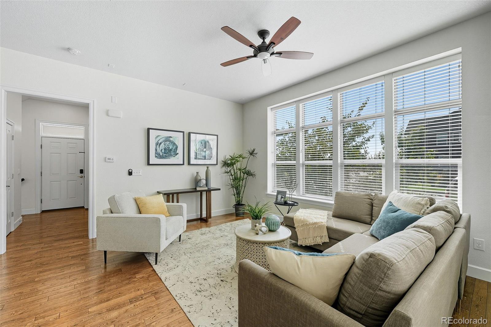 5207 Clinton Street Denver, CO 80238 - Photo 6 of 43 a living room with furniture and a large window