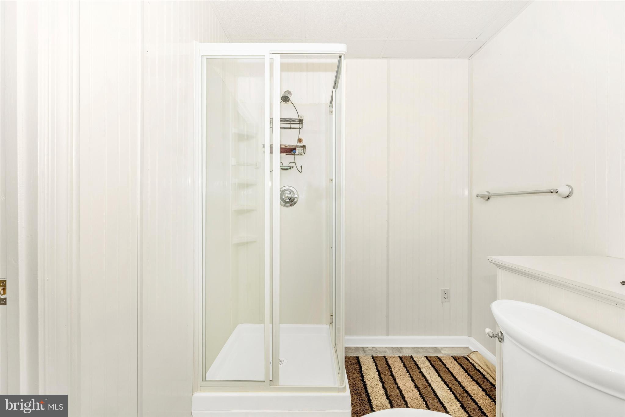 95 Burnside Court Frederick, MD 21702 - Photo 30 of 36 a bathroom with a shower and a toilet