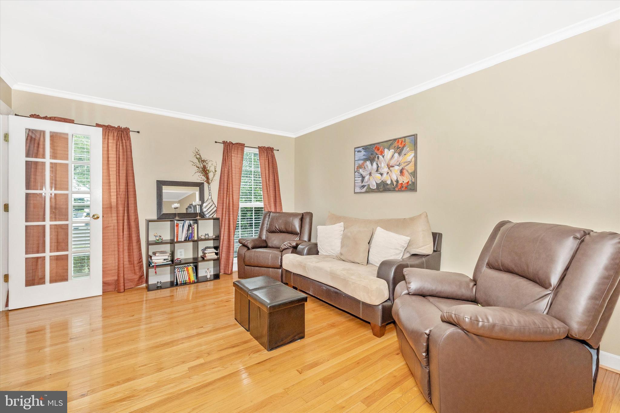 95 Burnside Court Frederick, MD 21702 - Photo 6 of 36 a living room with furniture and a floor to ceiling window